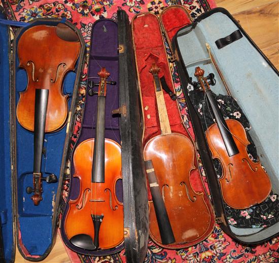 Four assorted cased violins